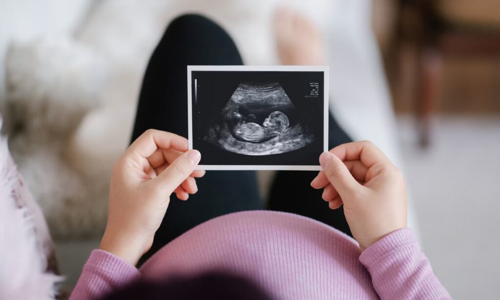 New mum holding baby picture